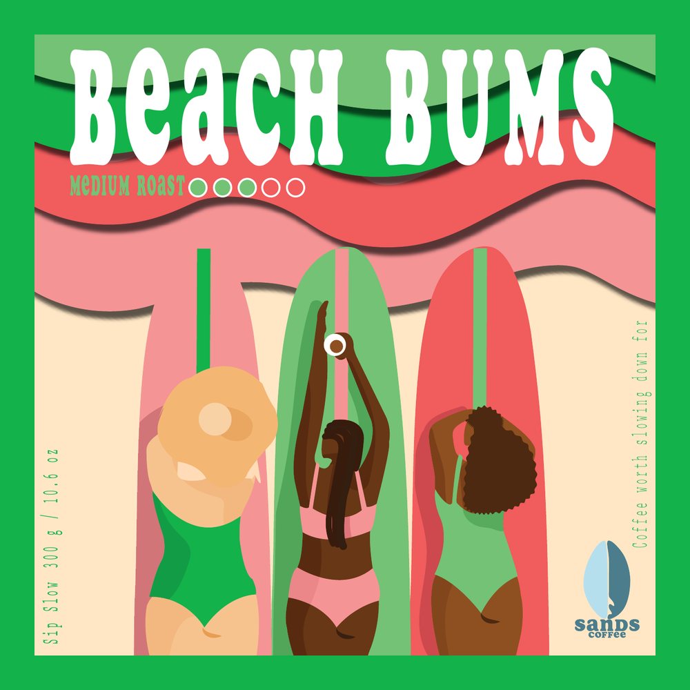 Beach Bums label, three surfboards in the sand