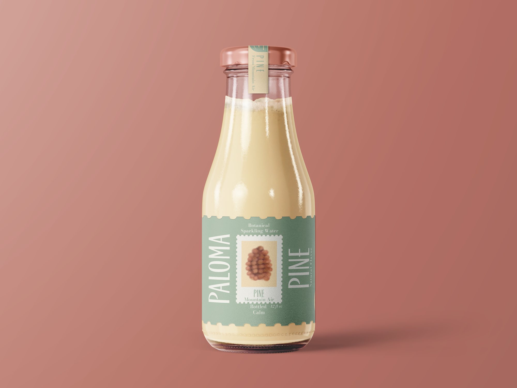 Paloma and Pine Pine flavor glass bottle with a sage green stamp-edged label and a pinecone illustration